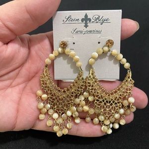 Gorgeous detailed beige tone hanging earrings